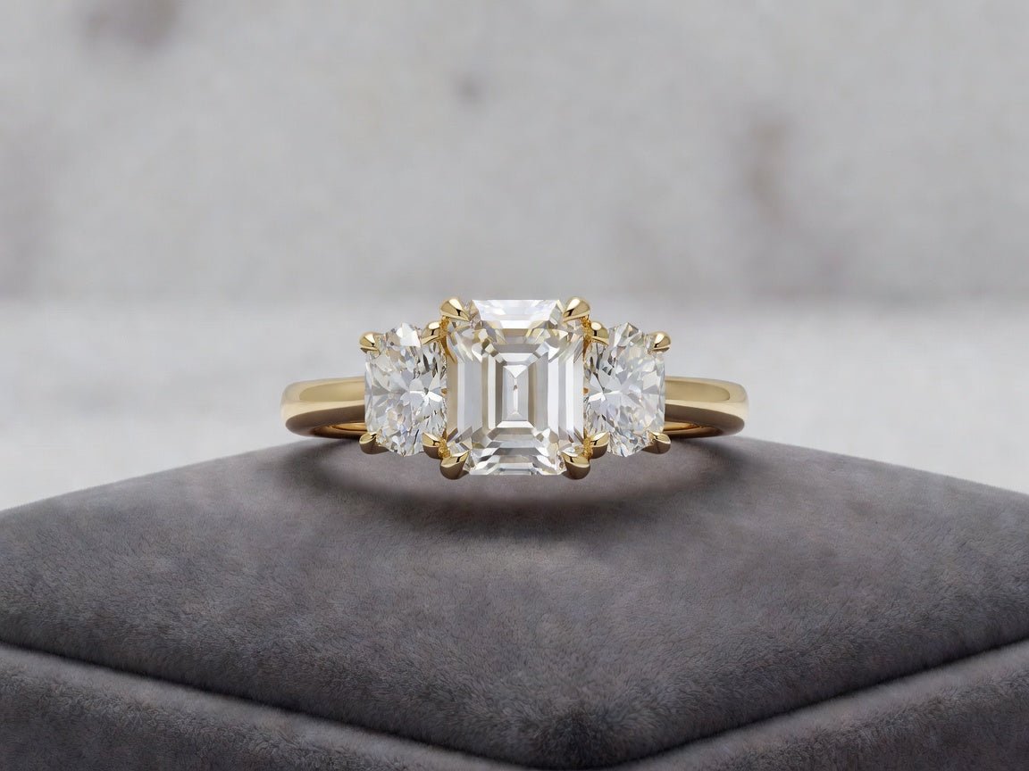 Why a Yellow Gold Three Stone Emerald Cut Ring is the Ultimate Classic